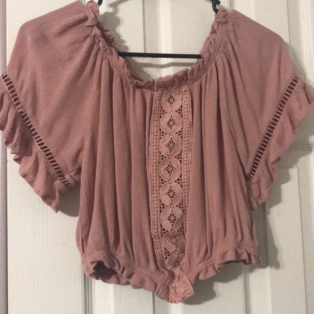 Pink off the shoulder shirt.